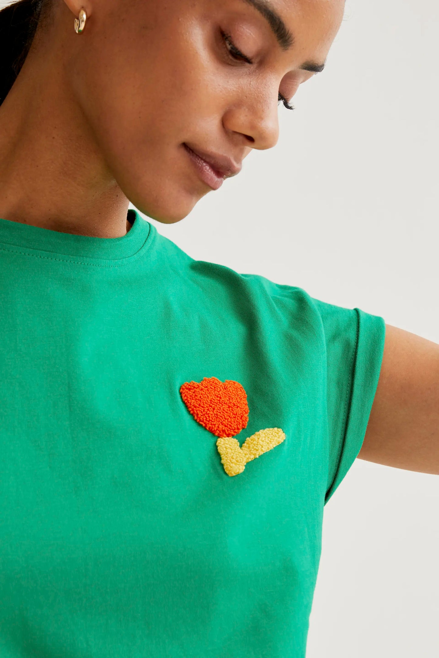 Green t-shirt with red tulip embroidery