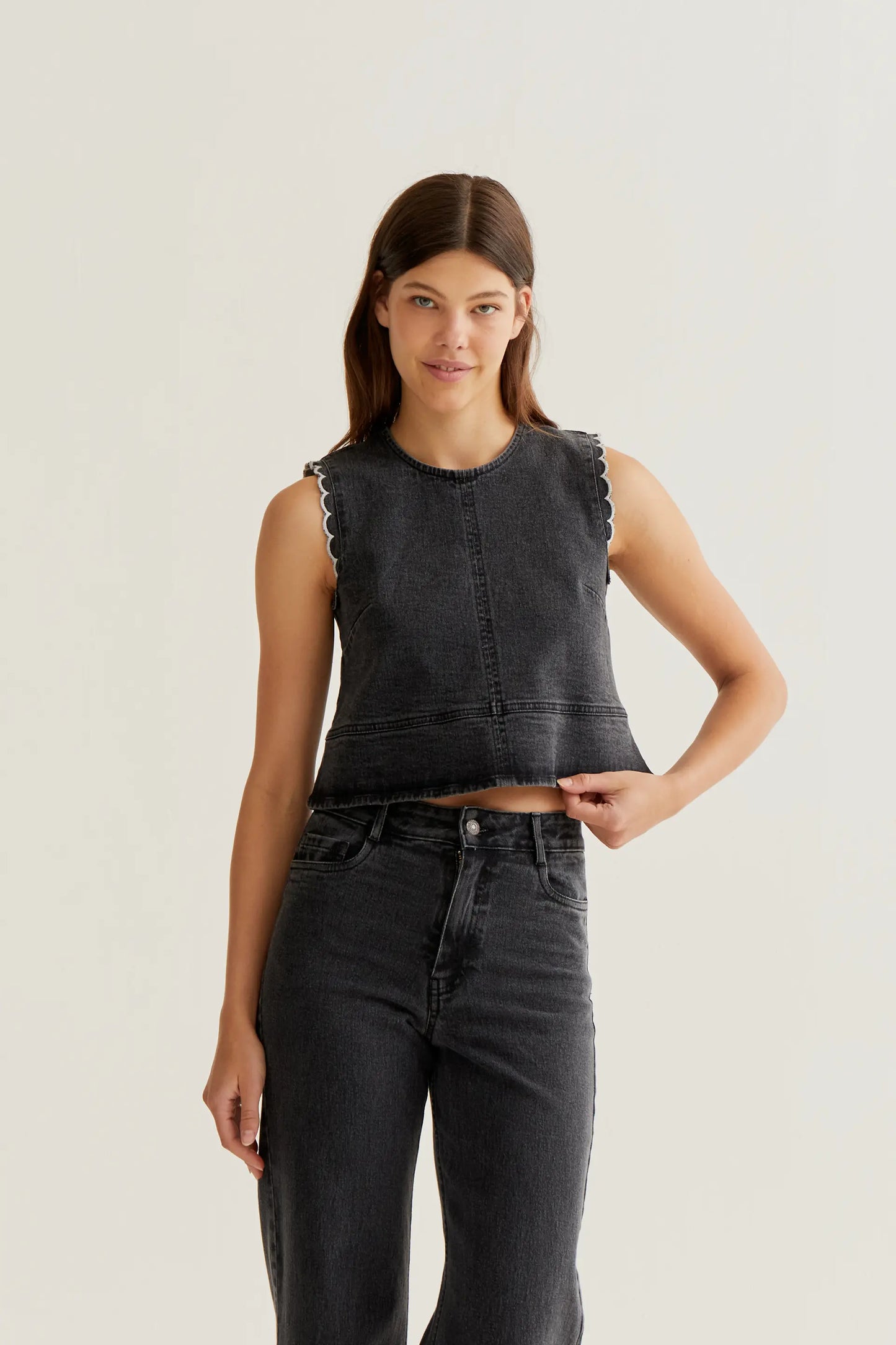 Black denim top with wavy details