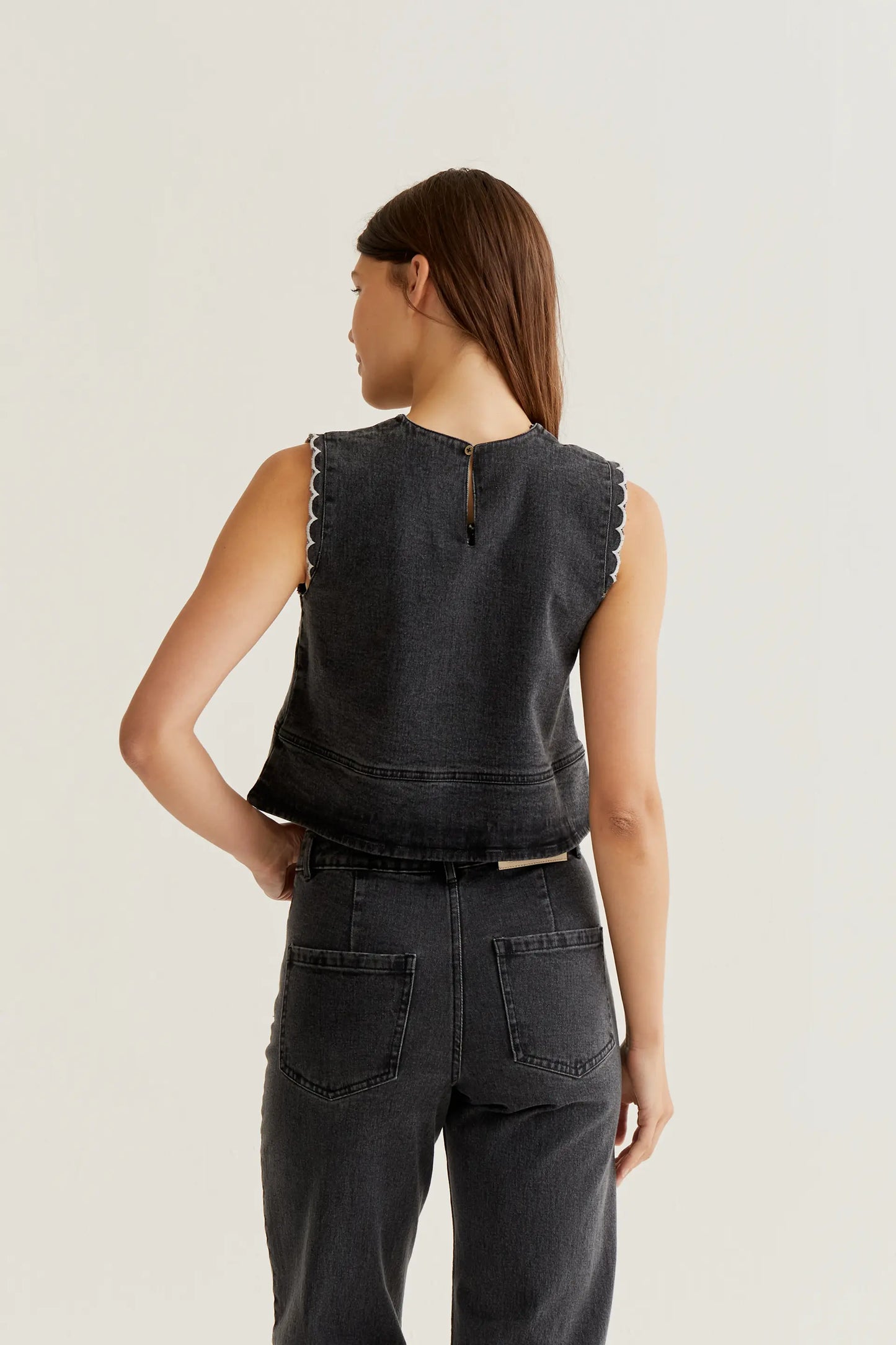 Black denim top with wavy details