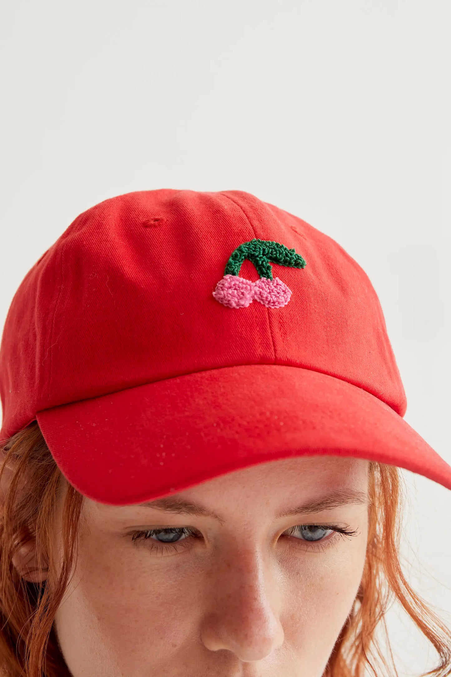 Red cap with cherry embroidery