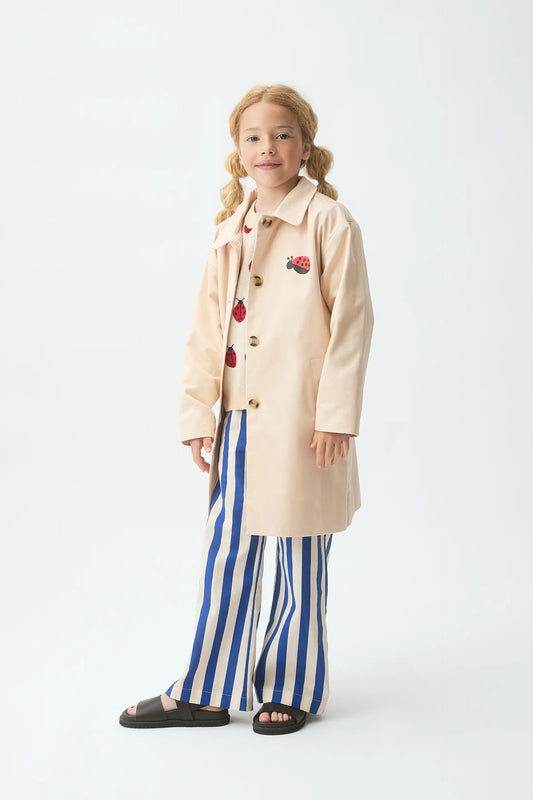 Gabardina de niña con print de Mariquita