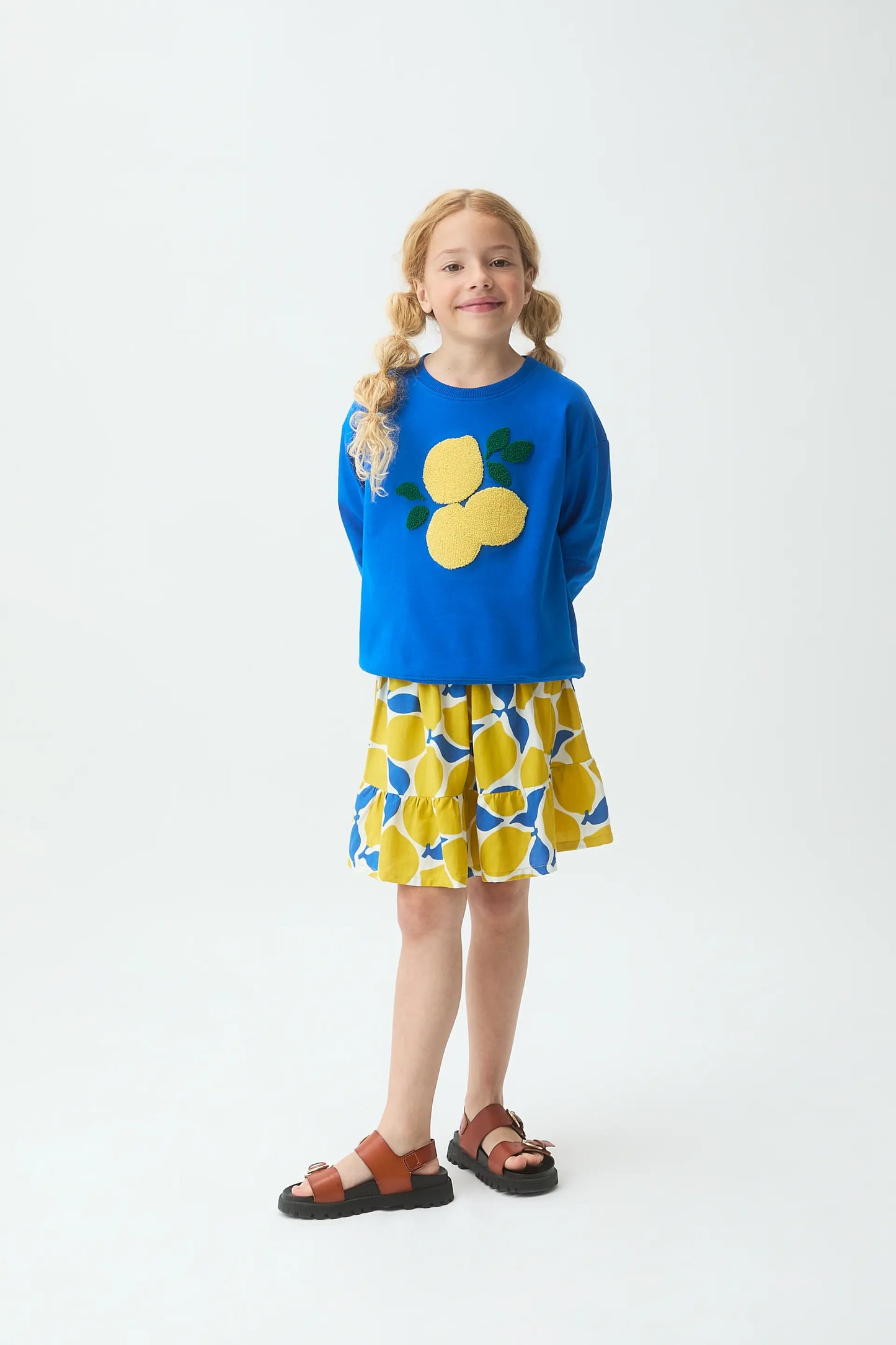 Blue girl's sweatshirt with lemon patch