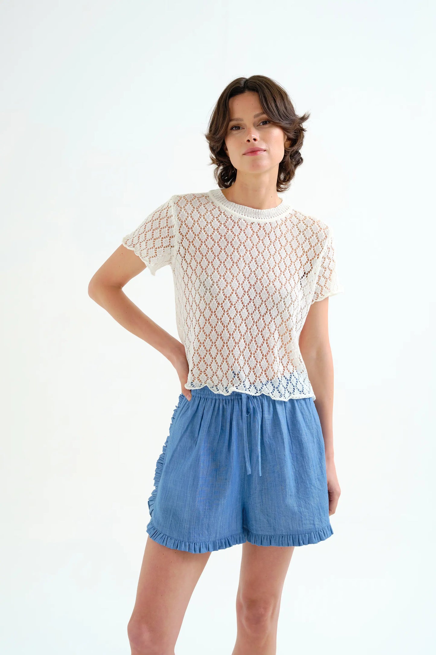 Top in maglia traforata bianca con motivo a rombi
