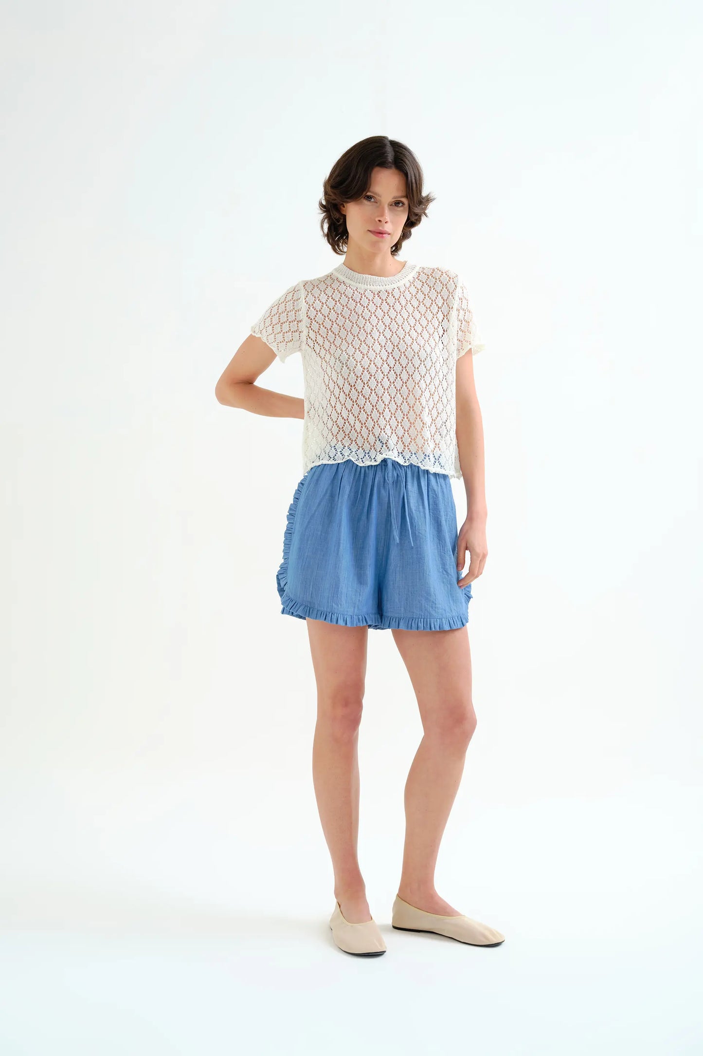 Top in maglia traforata bianca con motivo a rombi