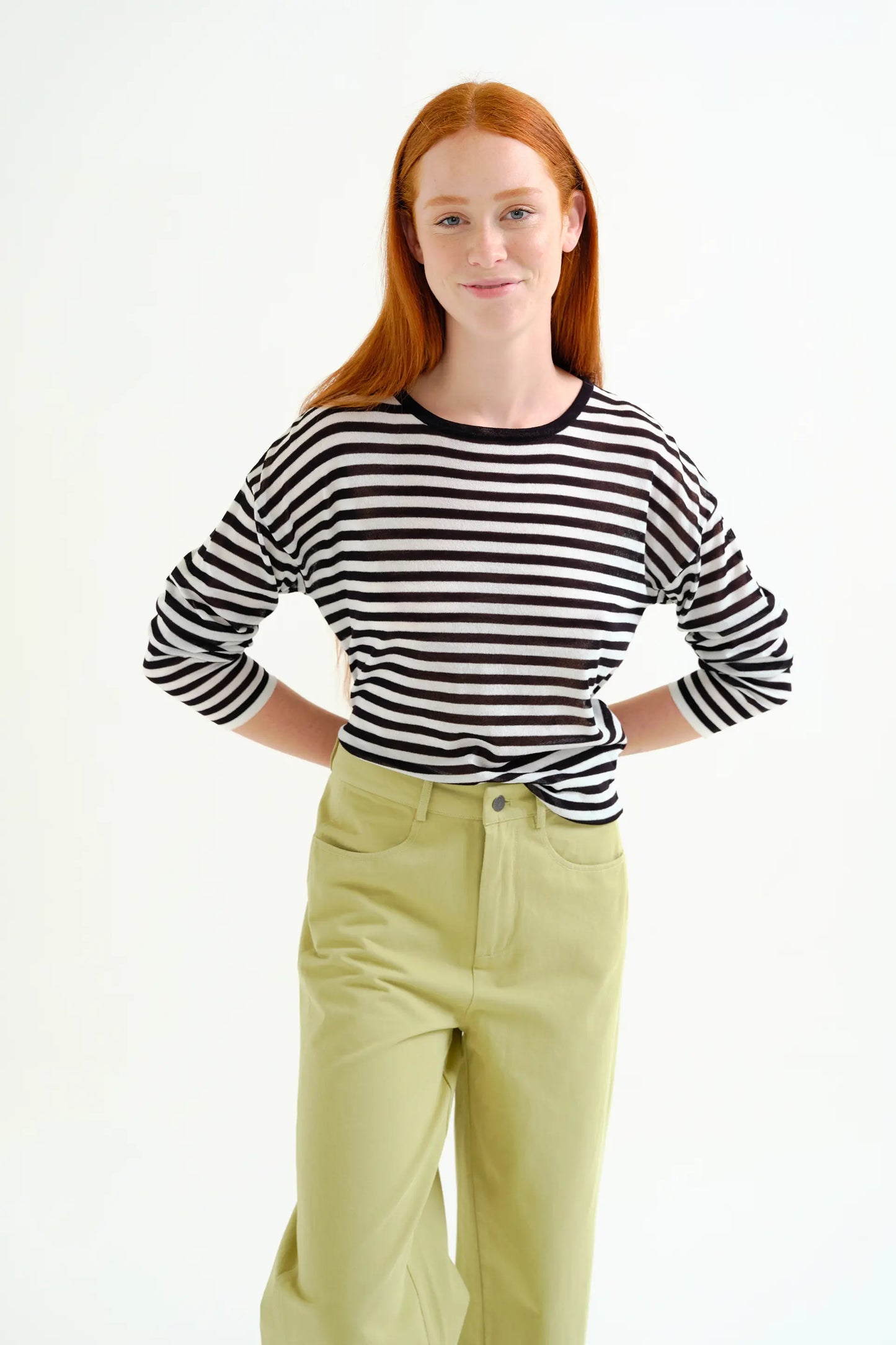 Soft knit sweater with black and white striped print