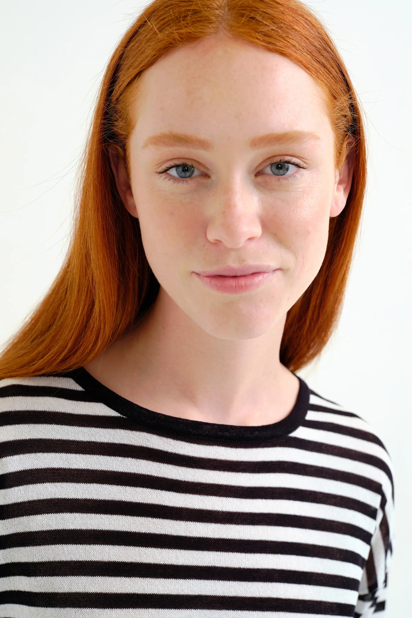 Soft knit sweater with black and white striped print