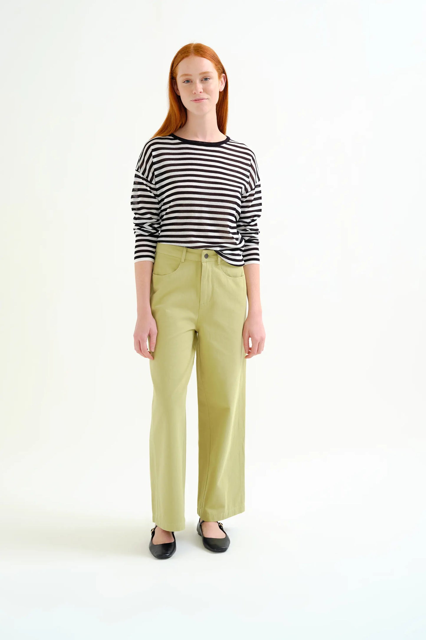 Soft knit sweater with black and white striped print