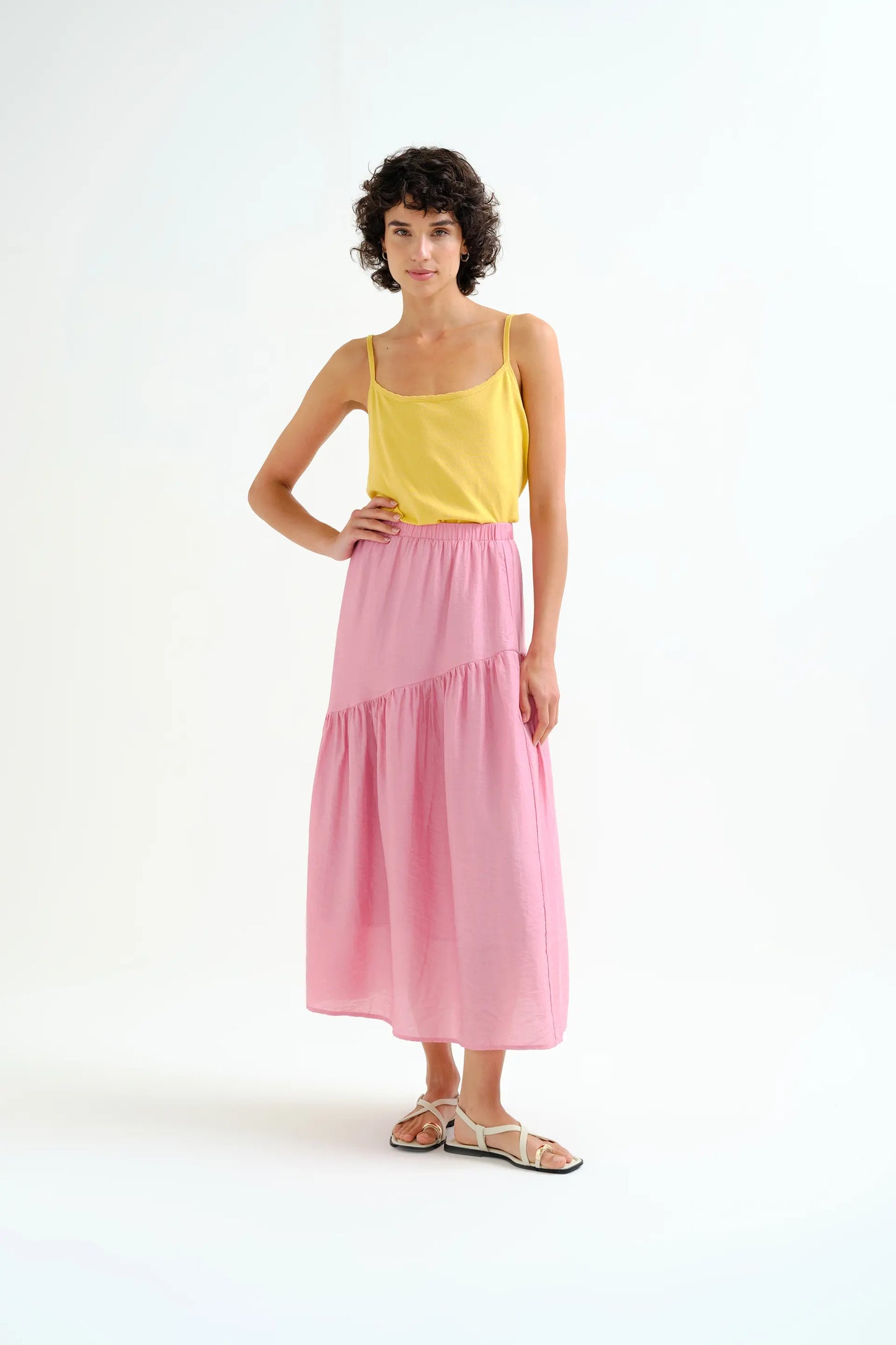 Long pink skirt with an asymmetrical cut