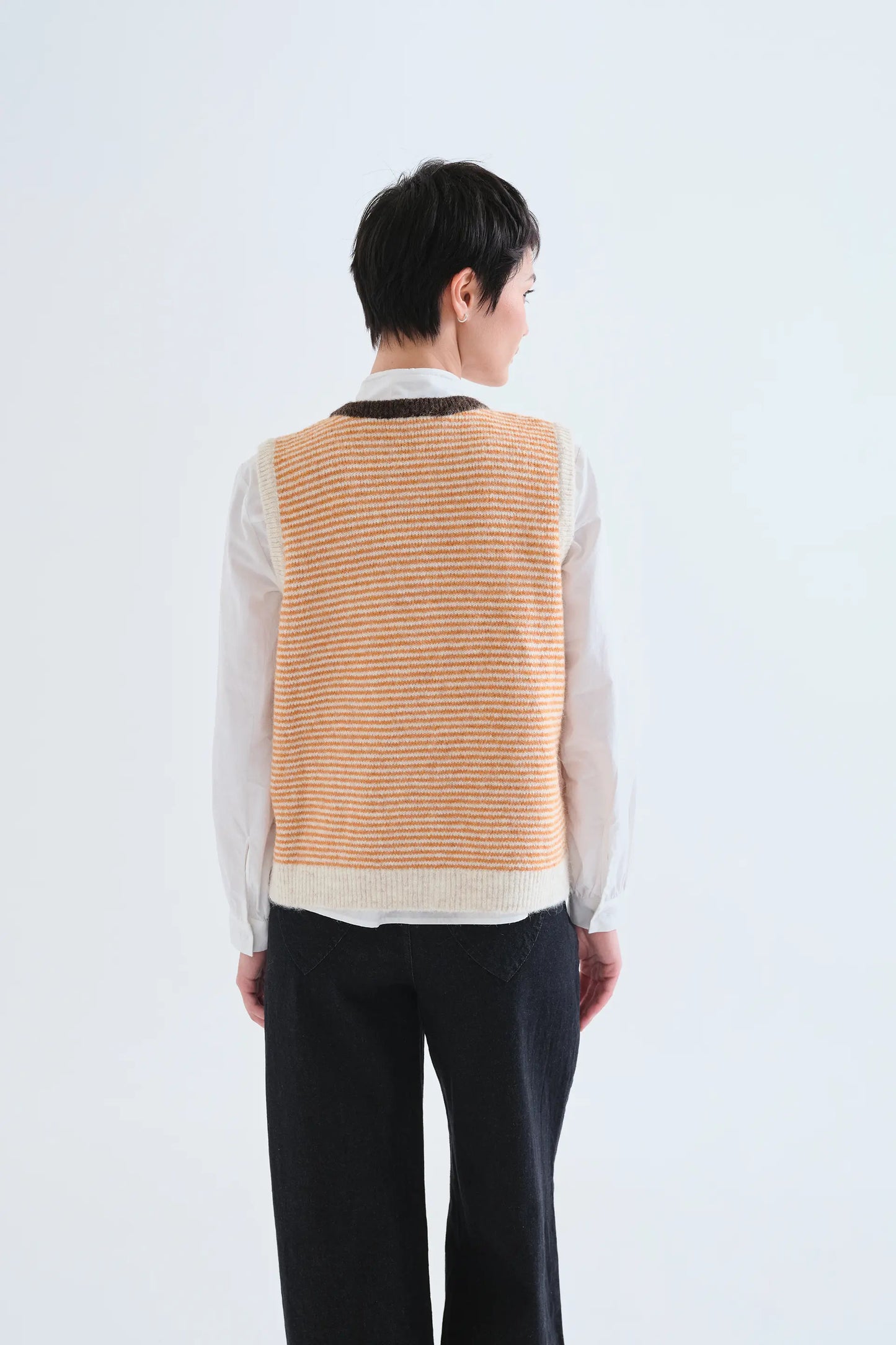 Orange and white striped knit vest