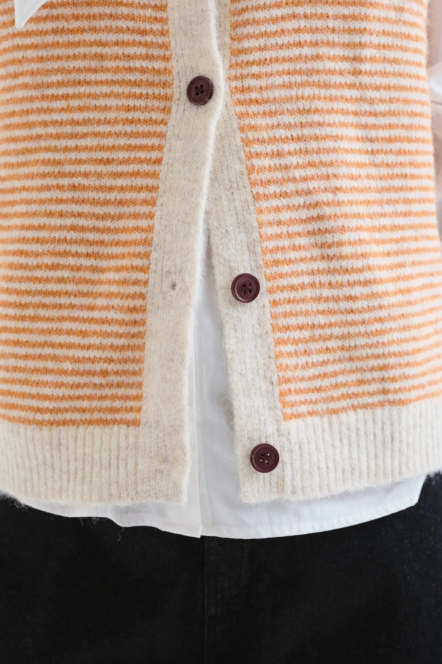 Orange and white striped knit vest