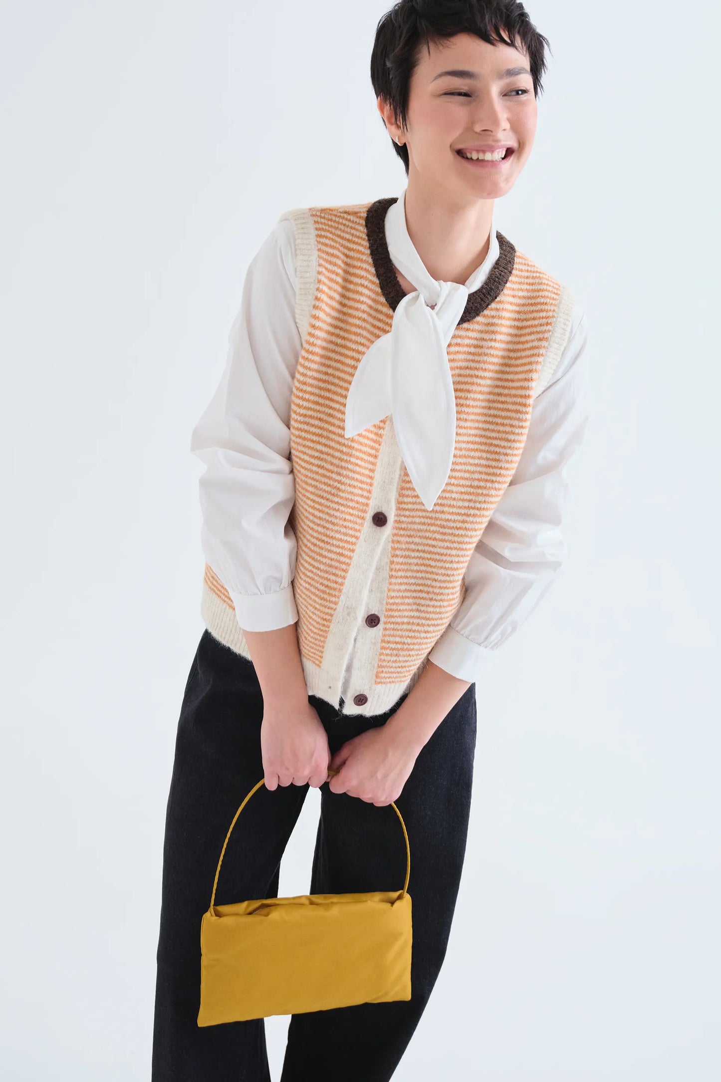 Orange and white striped knit vest