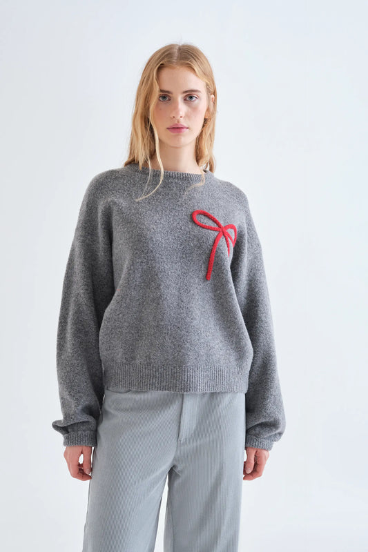 Jersey punto gris con detalle de lazo rojo