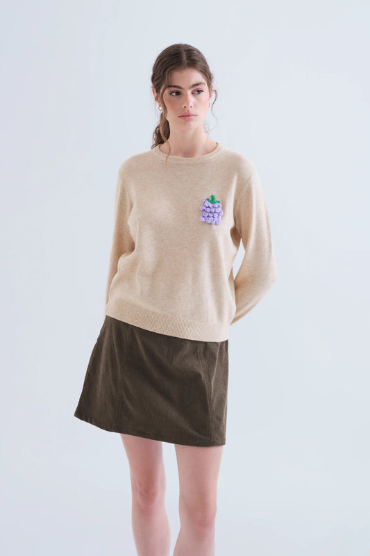Jersey punto beige con detalle de uva