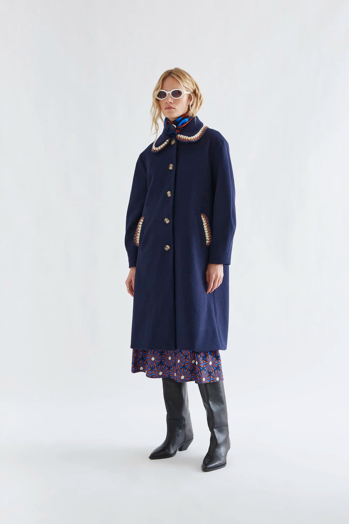 Navy blue coat with crochet details