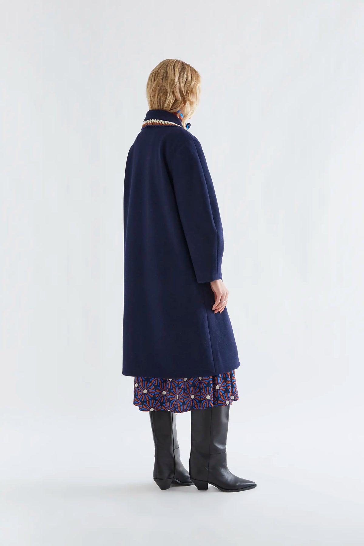 Navy blue coat with crochet details