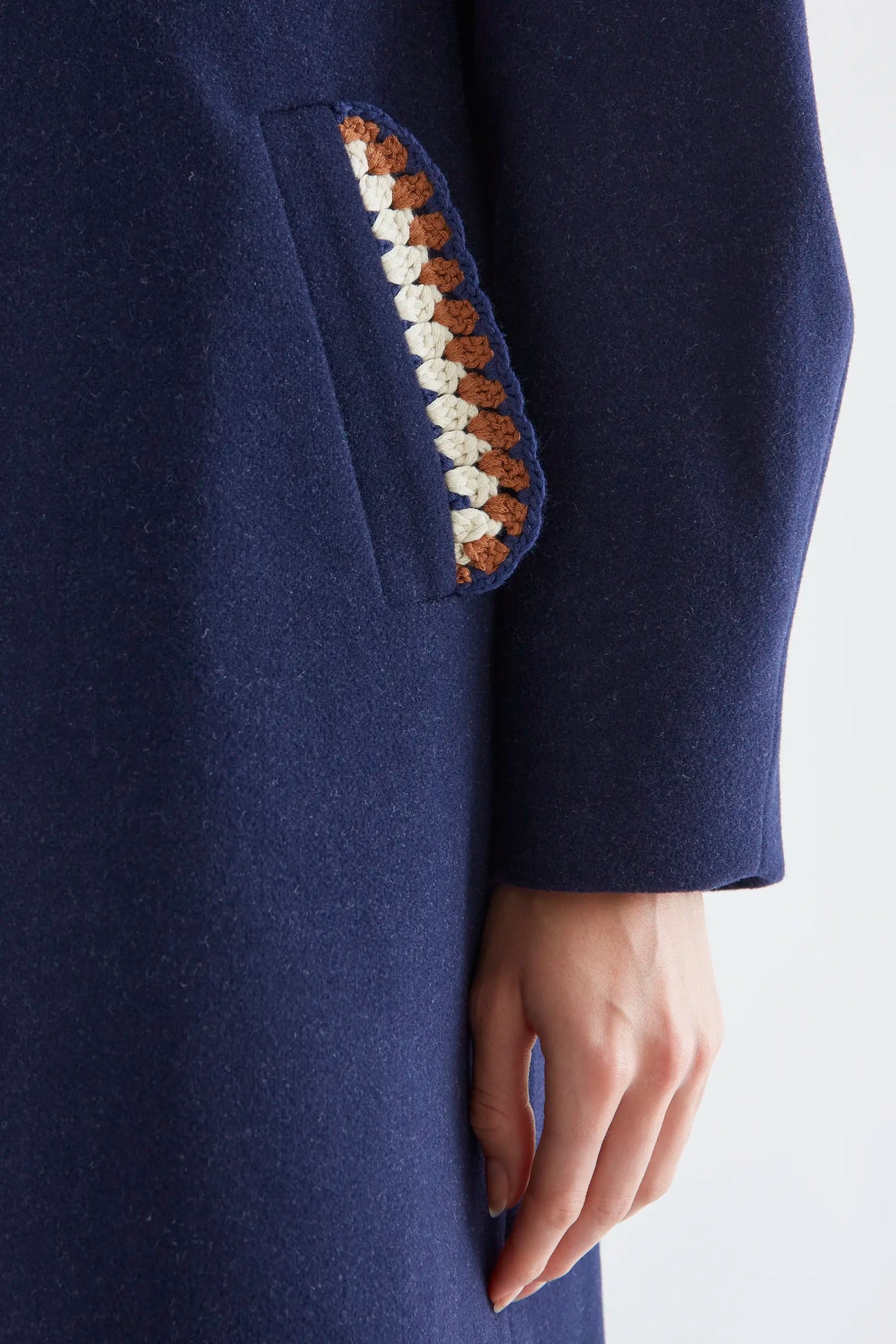 Navy blue coat with crochet details