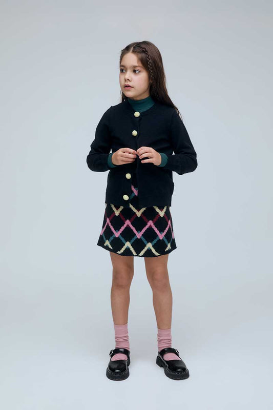 Cárdigan negro de niña negro con botones de pompones