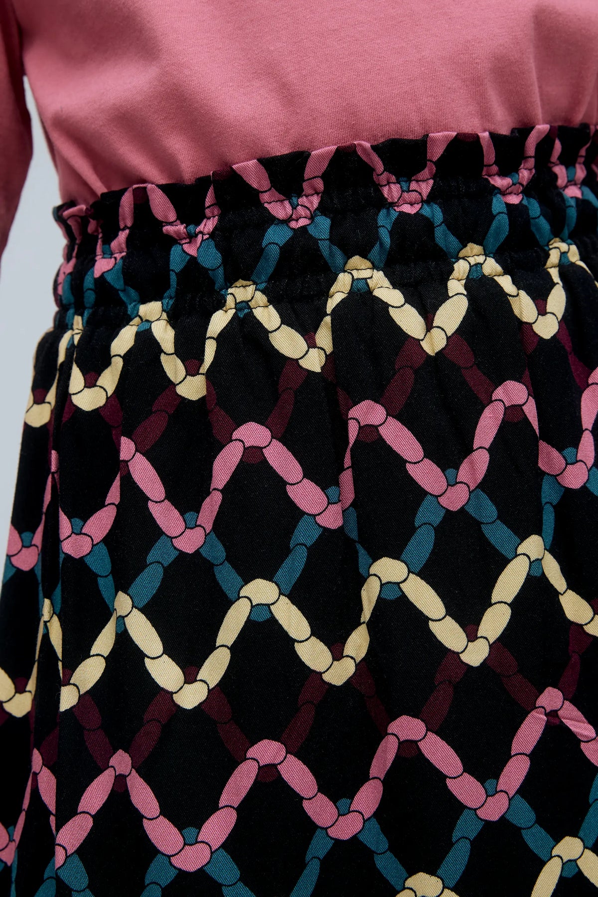 Falda corta de niña con estampado Skein